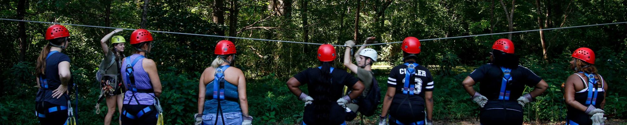 Trainer explaining zipline safety before a treetop canopy tour at Canaan Zipline Canopy Tours near Charlotte, NC